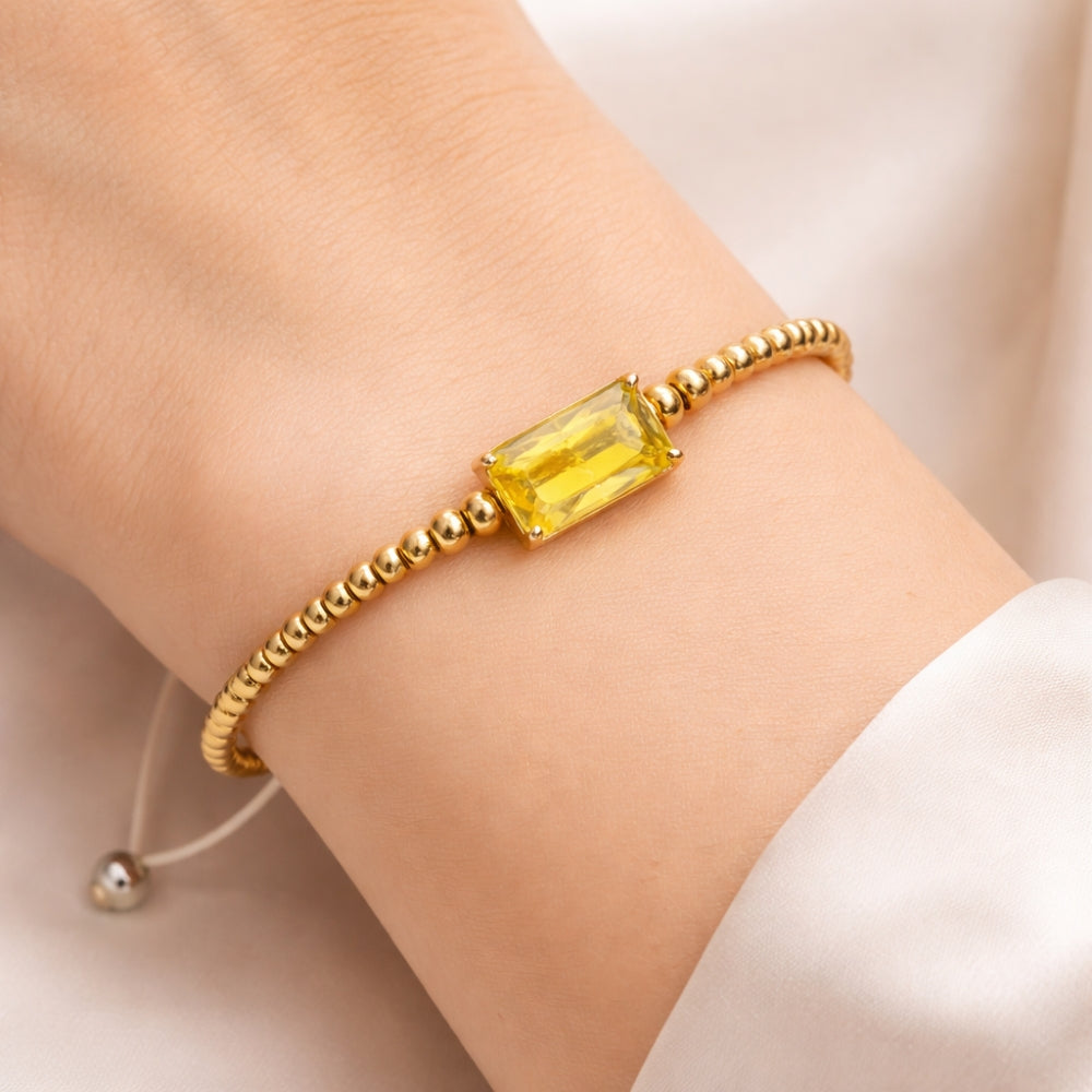 H&Co Pulsera Ajustable Para Damas de Hematita con Dije Yellow